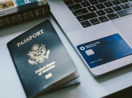 Image of passport, credit card, laptop