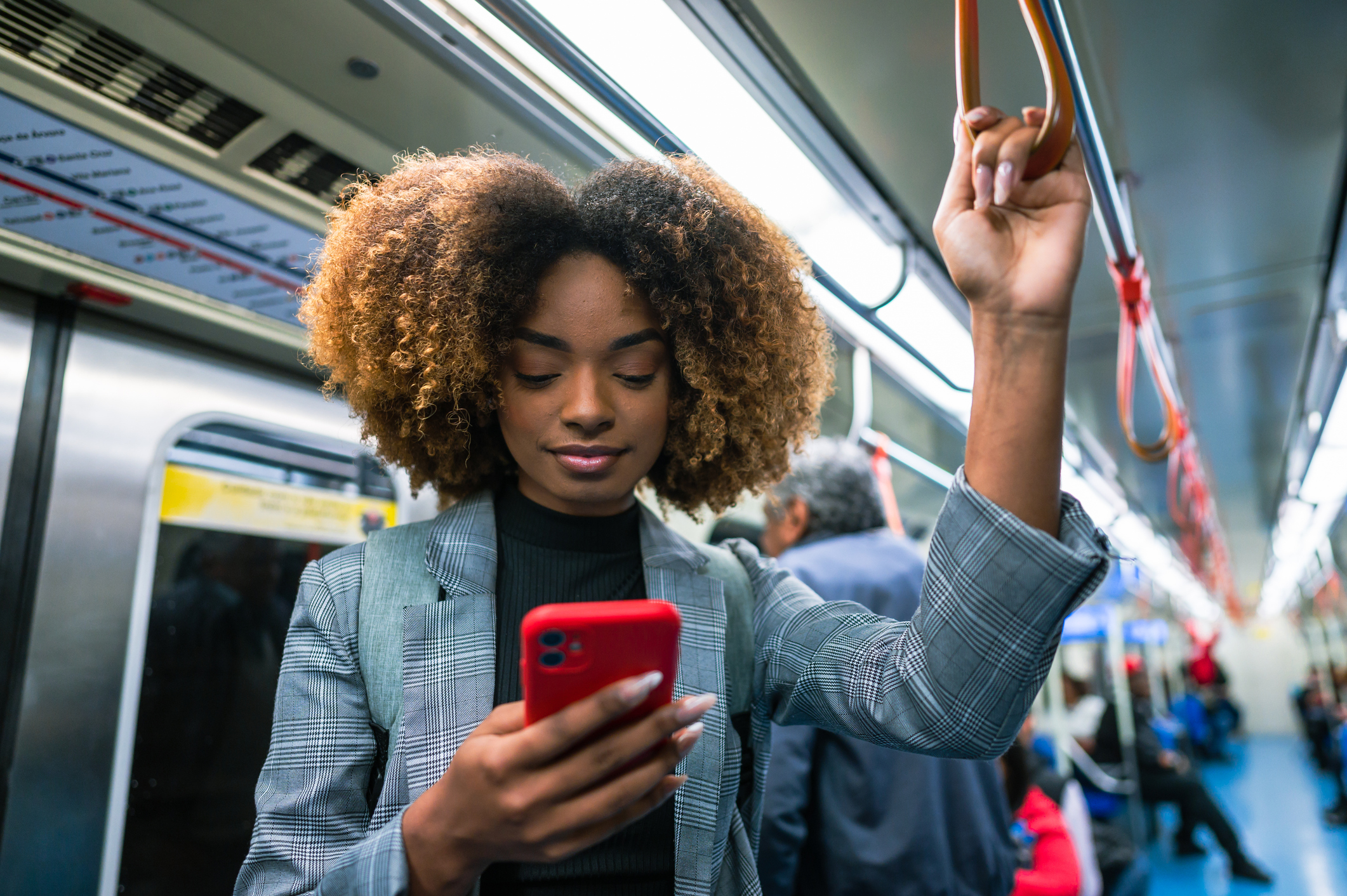 person on subway looking at phone