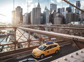 yellow taxi on bridge 