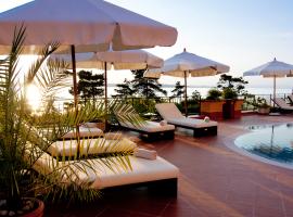 hotel pool with umbrellas and chairs