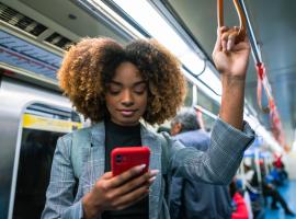 person on subway looking at phone