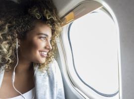 person looking out plane window