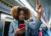 person on subway looking at phone
