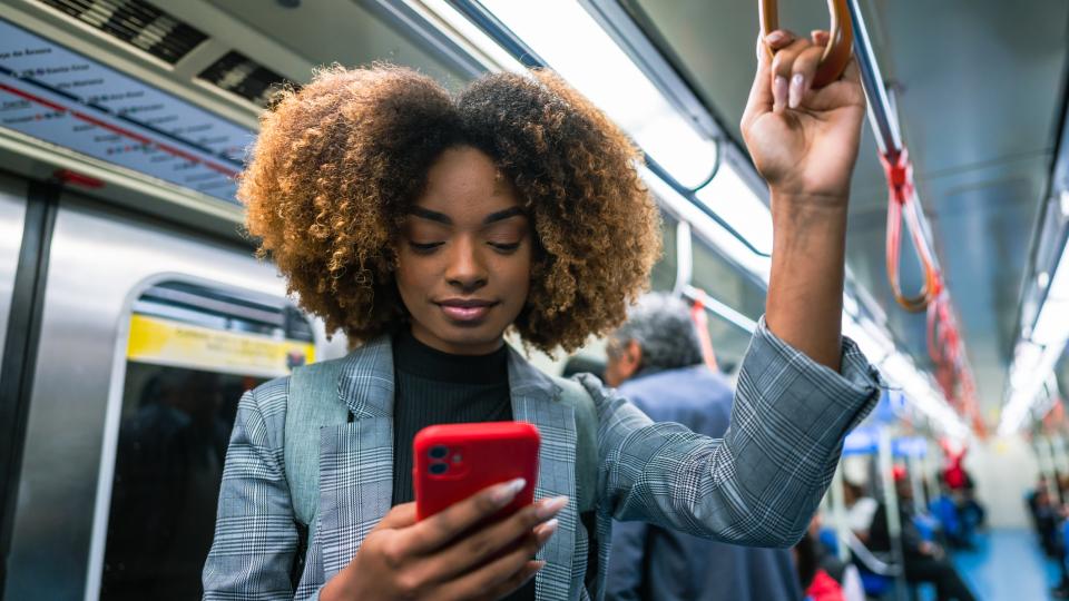 person on subway looking at phone