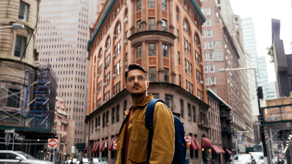 person amidst city buildings